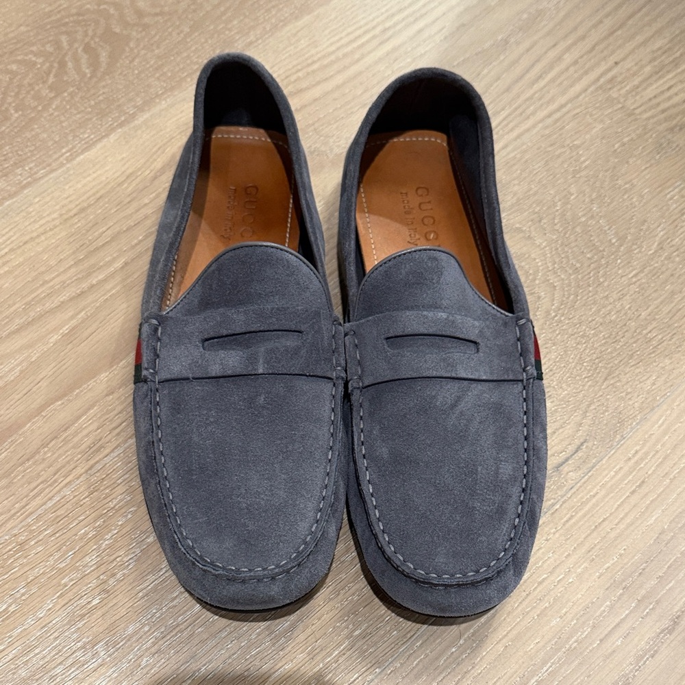 Grey suede Gucci moccasin loafer with red and greasy ribbon accent